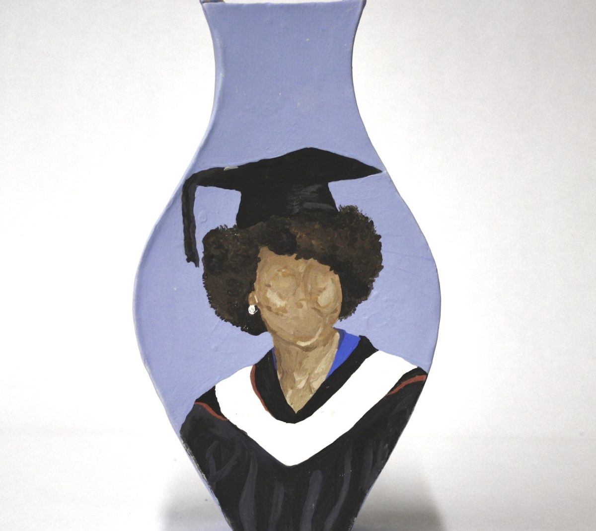 A ceramic vase painted with a portrait of former First Lady Michelle Obama wearing a graduation cap highlights themes of women’s leadership and education. (Courtesy of Sophie Smart)